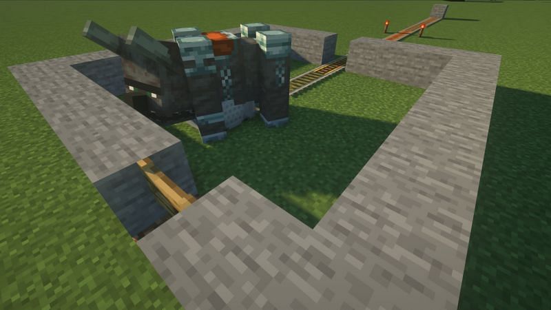 An incredibly basic example of a rail system sending a ravager to a one-block-high enclosure (Image via Mojang)