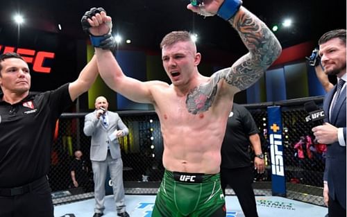 Marvin Vettori (center) reacts after winning the bout against Paulo Costa at UFC Vegas 41 [Image Credit: @ufc on Instagram]