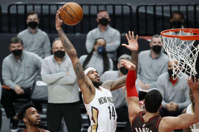 PORTLAND, OREGON - MARCH 18: Brandon Ingram #14 of the New Orleans Pelicans attempts to dunk over Enes Kanter #11 of the Portland Trail Blazers during the first quarter at Moda Center on March 18, 2021 in Portland, Oregon.