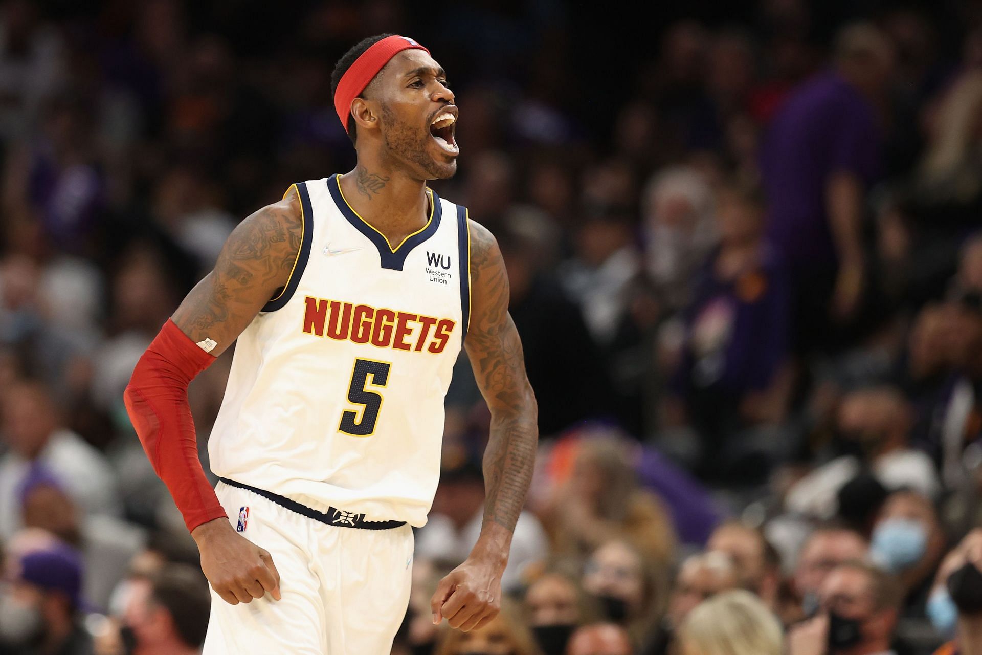 Will Barton #5 of the Denver Nuggets reacts after a three-point shot against the Phoenix Suns during the second half of the NBA game at Footprint Center on October 20, 2021 in Phoenix, Arizona.