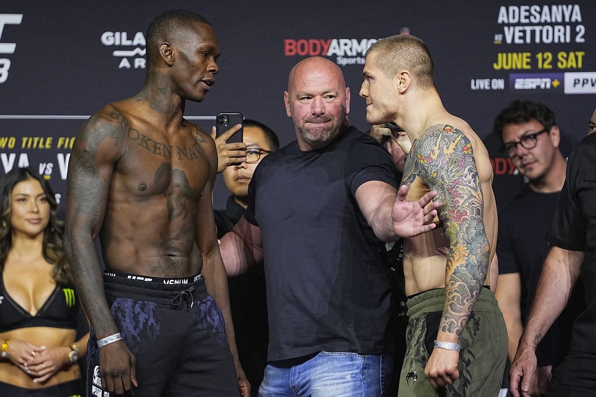 Israel Adesanya and Marvin Vettori facing off with one another