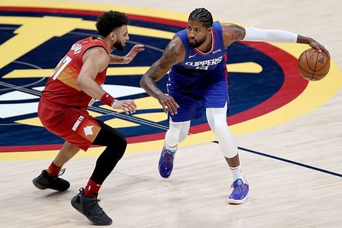 Paul George of the LA Clippers \guarded by Jamal Murray of the Denver Nuggets.