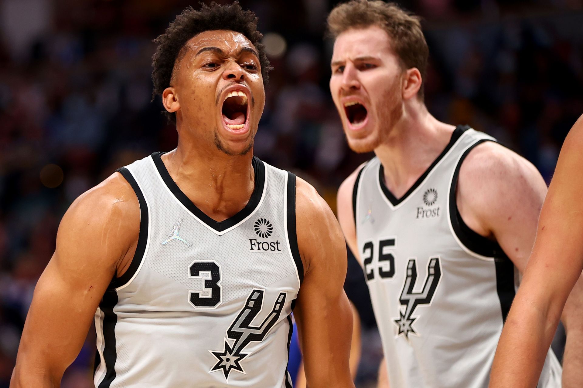 The San Antonio Spurs celebrate a play against the Denver Nuggets.