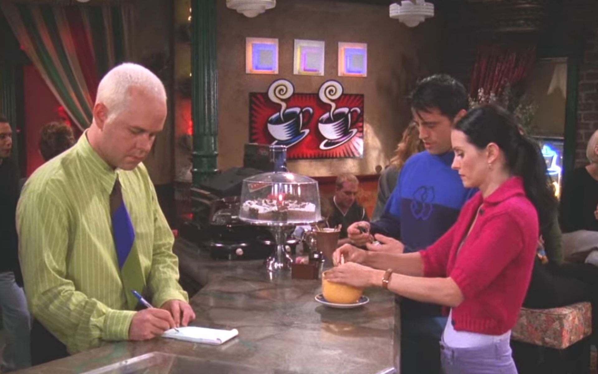 Gunther&#039;s dry humor leaves Joey grinning while Monica watches in disbelief (Image via Netflix)