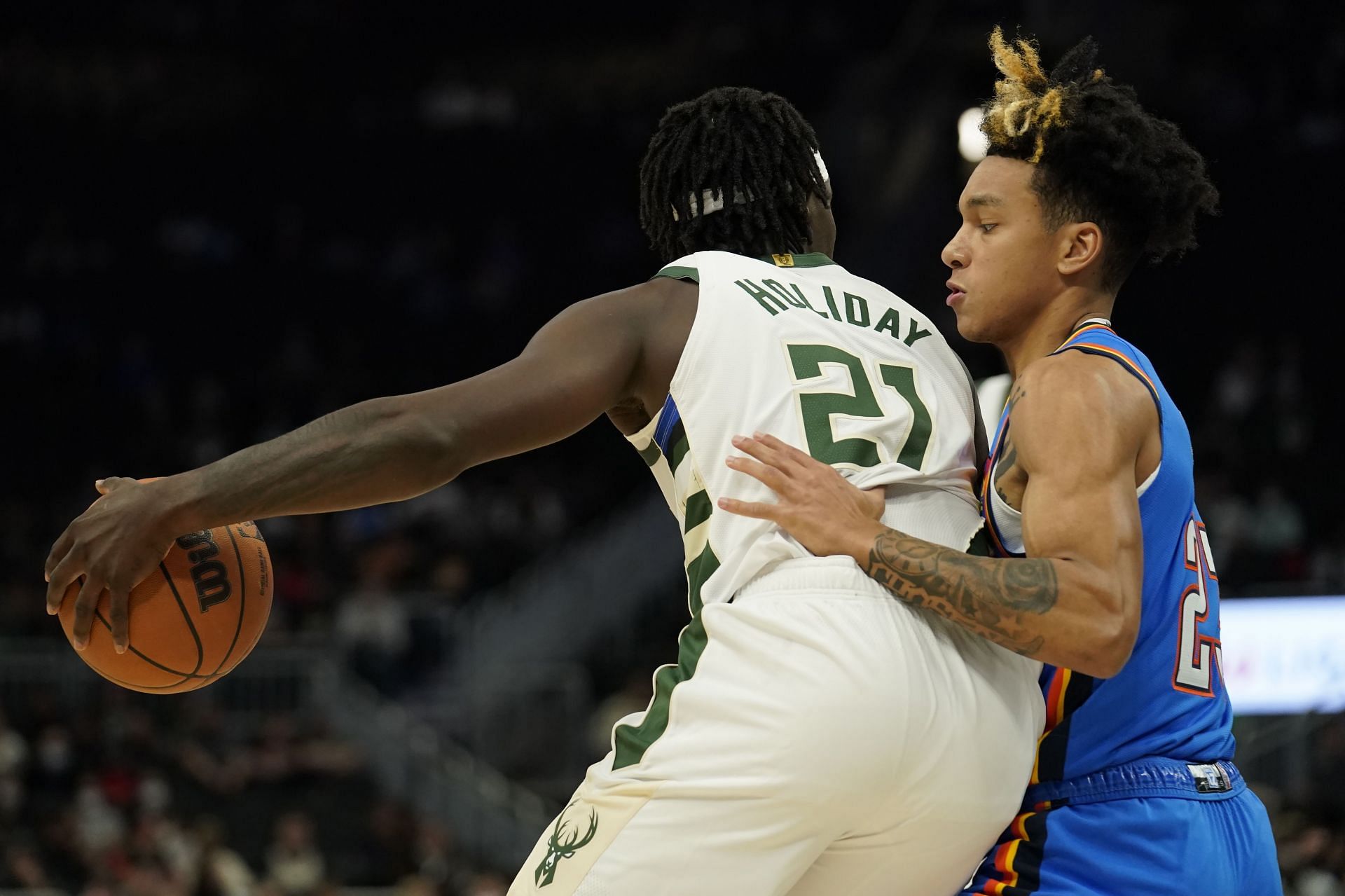 Jrue Holiday scans the floor for the Milwaukee Bucks