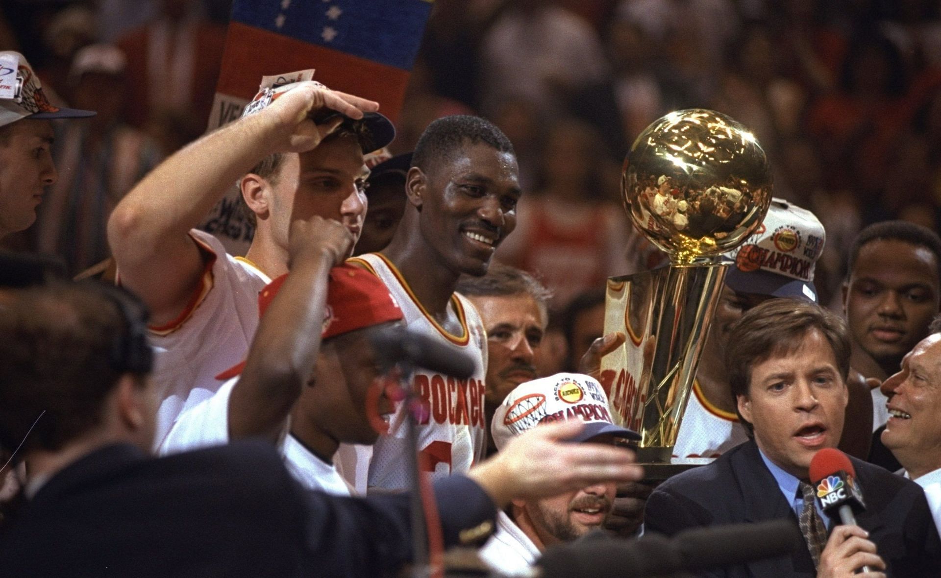 Hakeem Olajuwon celebrates winning the NBA title with the Houston Rockets.