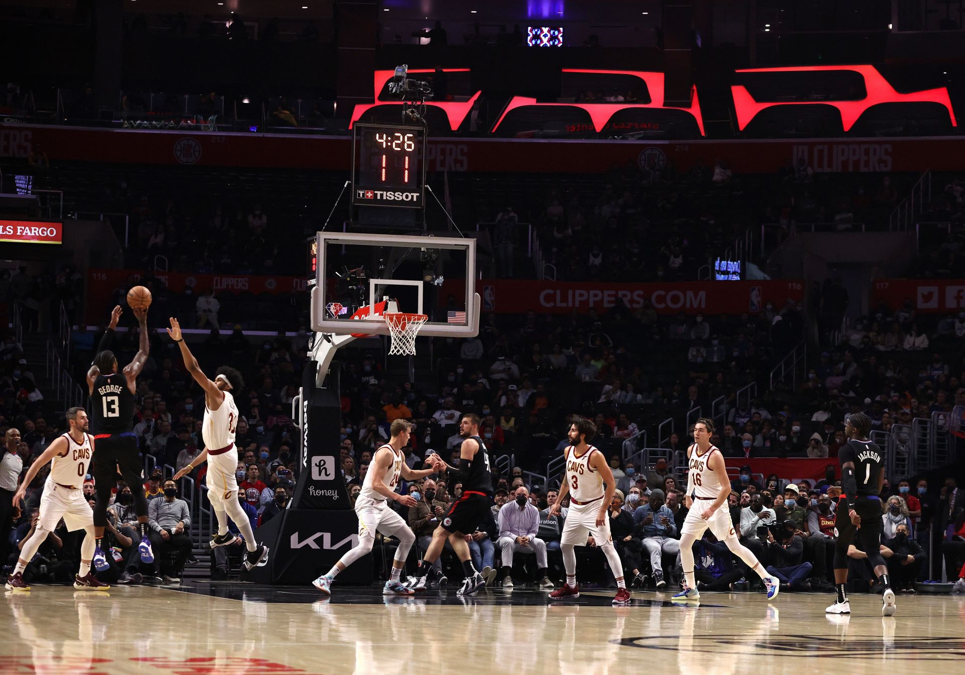 Paul George hitting a three-pointer over Jarrett Allen of the Cleveland Cavaliers.