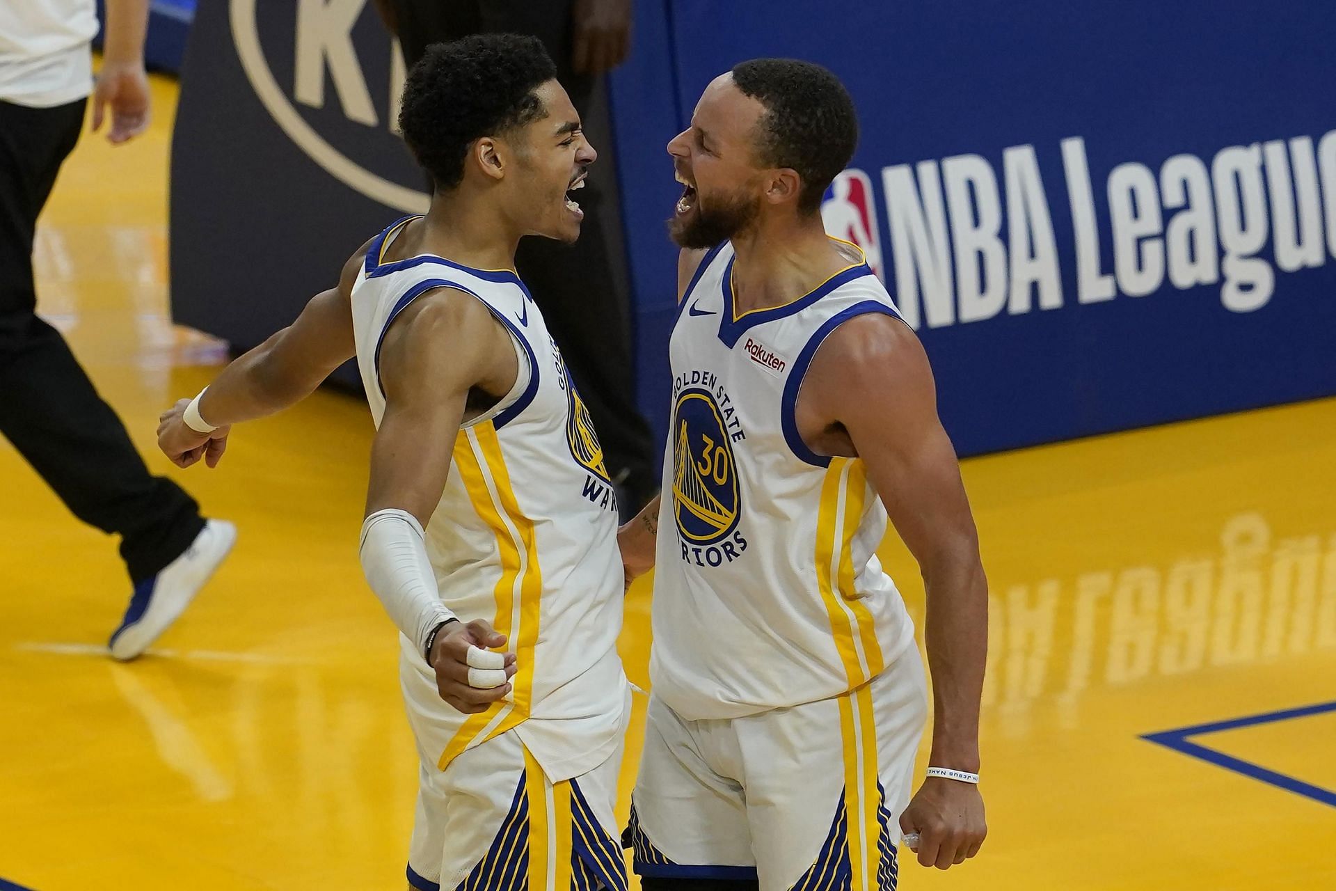 Jordan Poole and Stephen Curry of the Golden State Warriors celebrate [Source: AP]