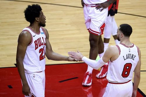 Thaddeus Young (#21) high fives Zach LaVine (#8) of the Chicago Bulls.