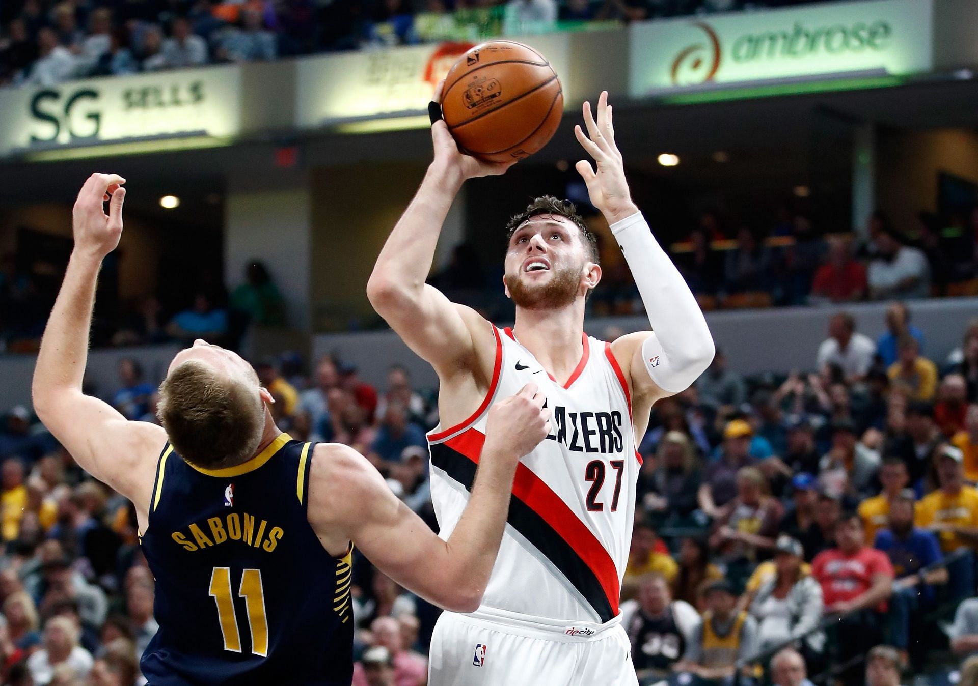 Jusuf Nurkic of the Portland Trail Blazers shoots over Domantas Sabonis of the Indiana Pacers.