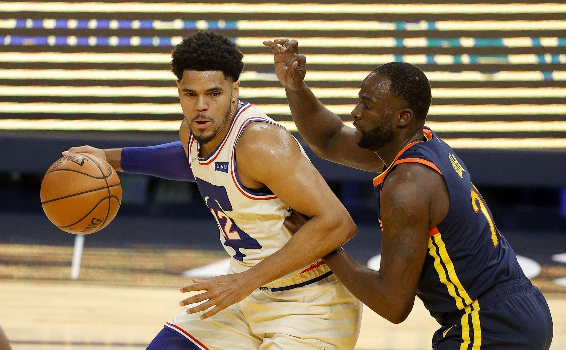 Tobias Harris of the Philadelphia 76ers and Draymond Green of the Golden State Warriors