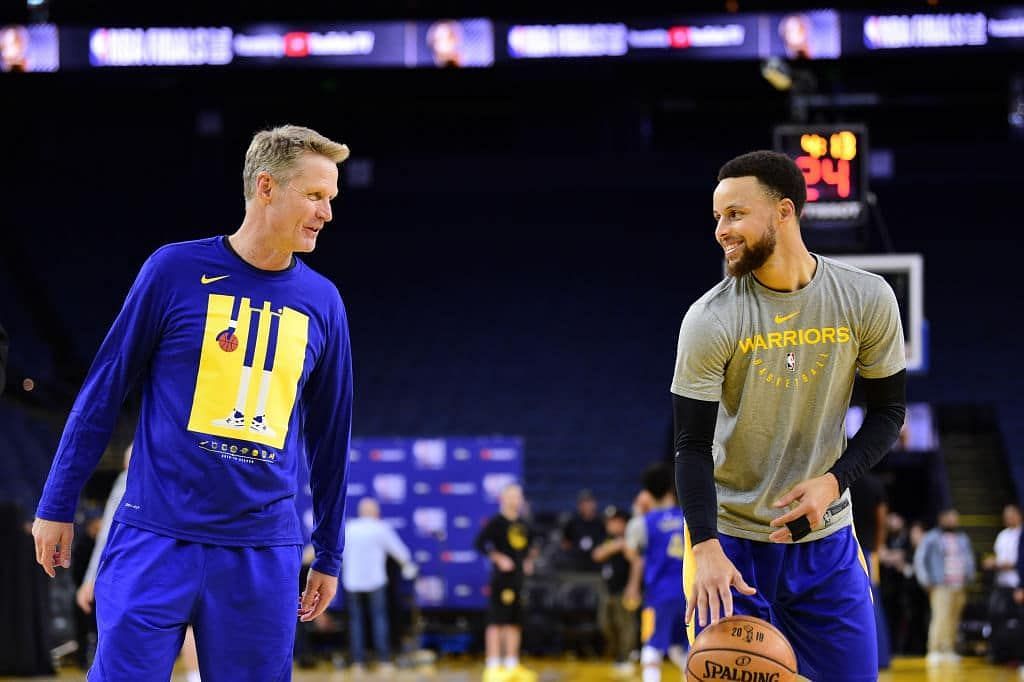 Head coach Steve Kerr and Stephen Curry of the Golden State Warriors