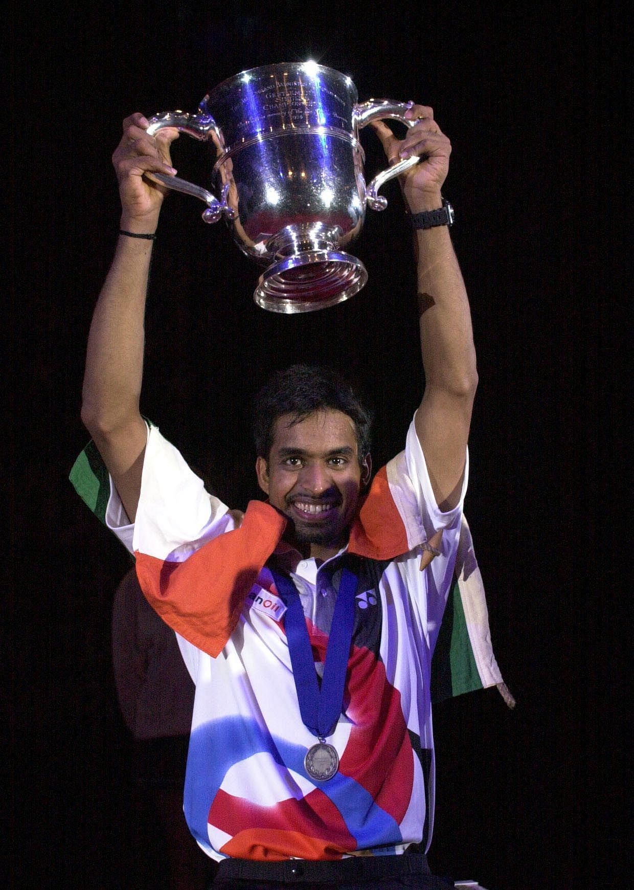 Pullela Gopichand holds aloft the Yonex All England Open trophy (Image credits: Getty Images).