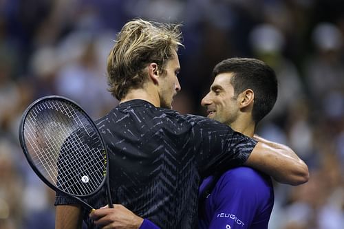 Alexander Zverev (L) and Novak Djokovic after their 2021 US Open semifinal