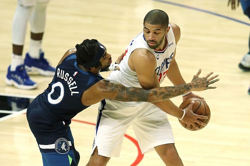 D'Angelo Russell of the Minnesota Timberwolves and Nicolas Batum of the Los Angeles Clippers.