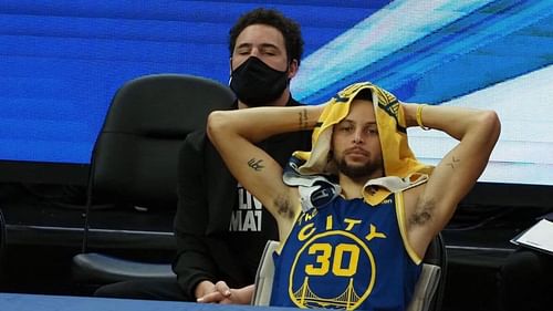 Stephen Curry and Klay Thompson of the Golden State Warriors on the bench