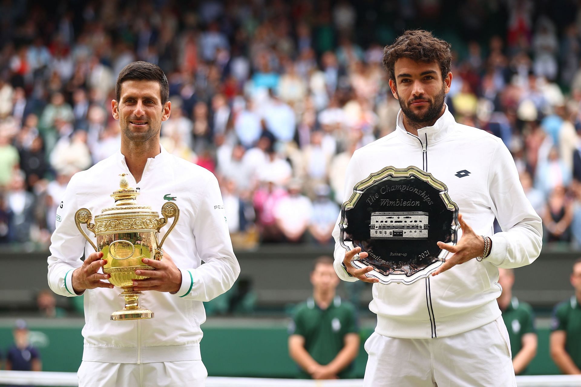 Novak Djokovic and Matteo Berrettini with their respective trophies after the Wimbledon 2021 final