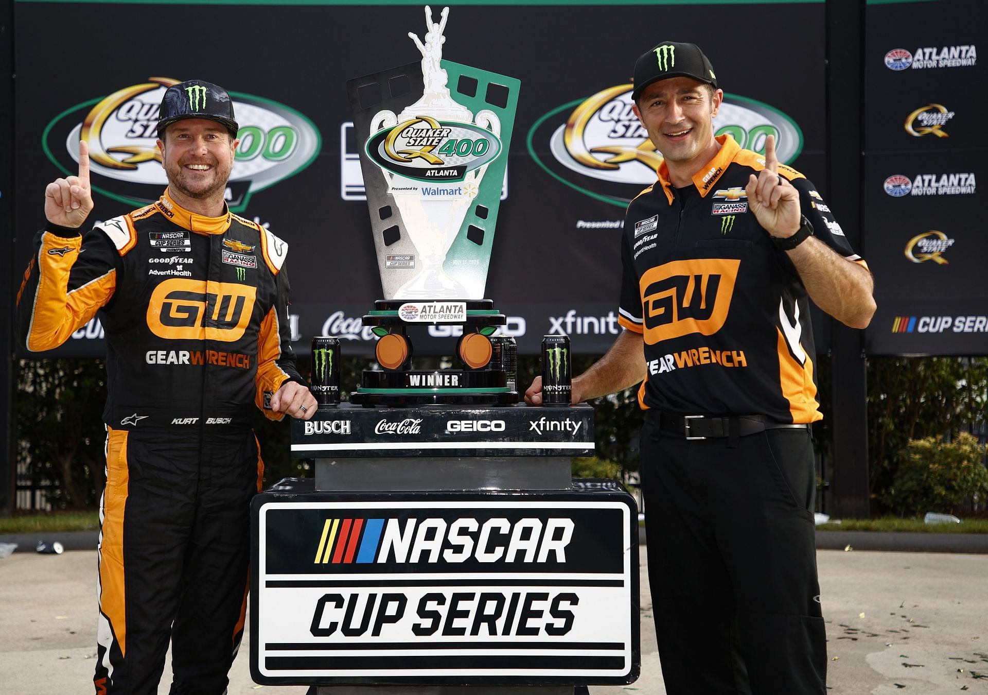 Kurt Busch and crew chief Matt McCall (right) celebrate in victory lane after winning the NASCAR Cup Series Quaker State 400 at Atlanta in July. (Photo by Jared C. Tilton/Getty Images)