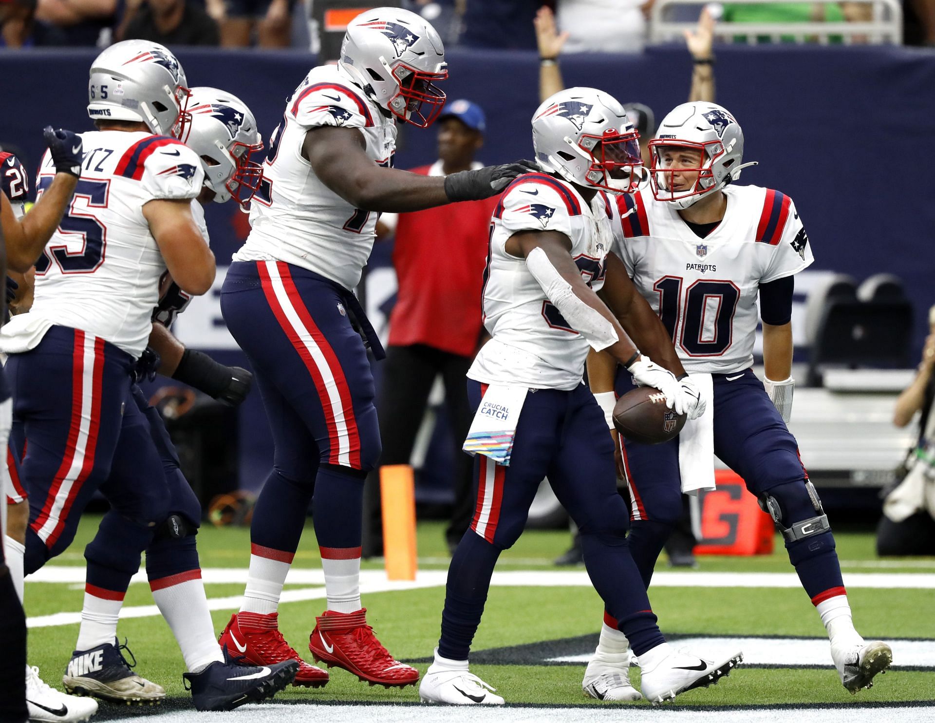 New England Patriots quarterback Mac Jones and running back Damien Harris