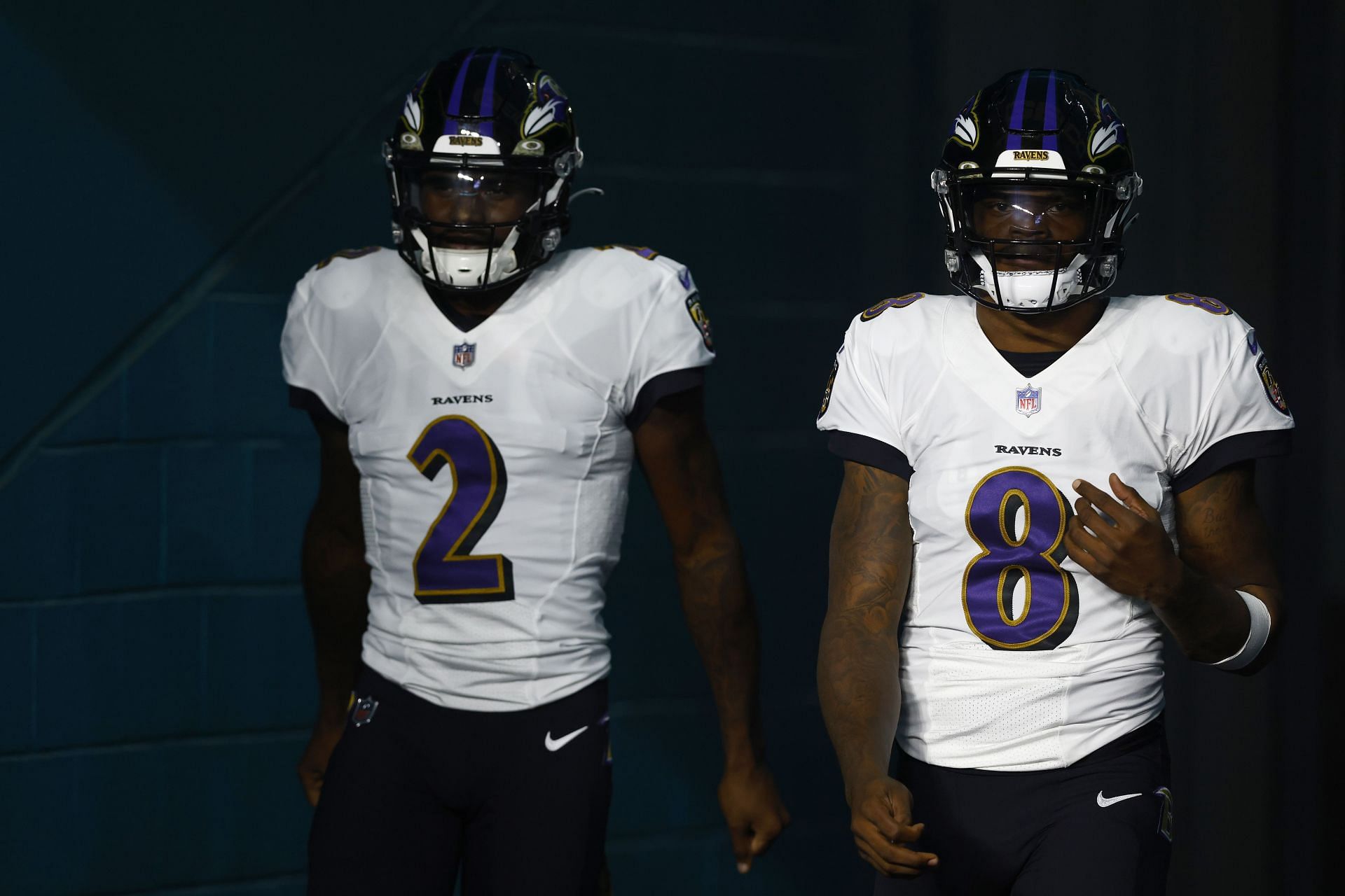 Baltimore Ravens quarterbacks Tyler Huntley (left) and Lamar Jackson (right)