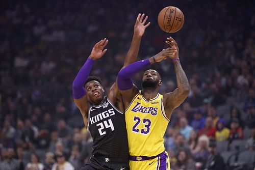 Buddy Hield of the Sacramento Kings and LeBron James of the LA Lakers