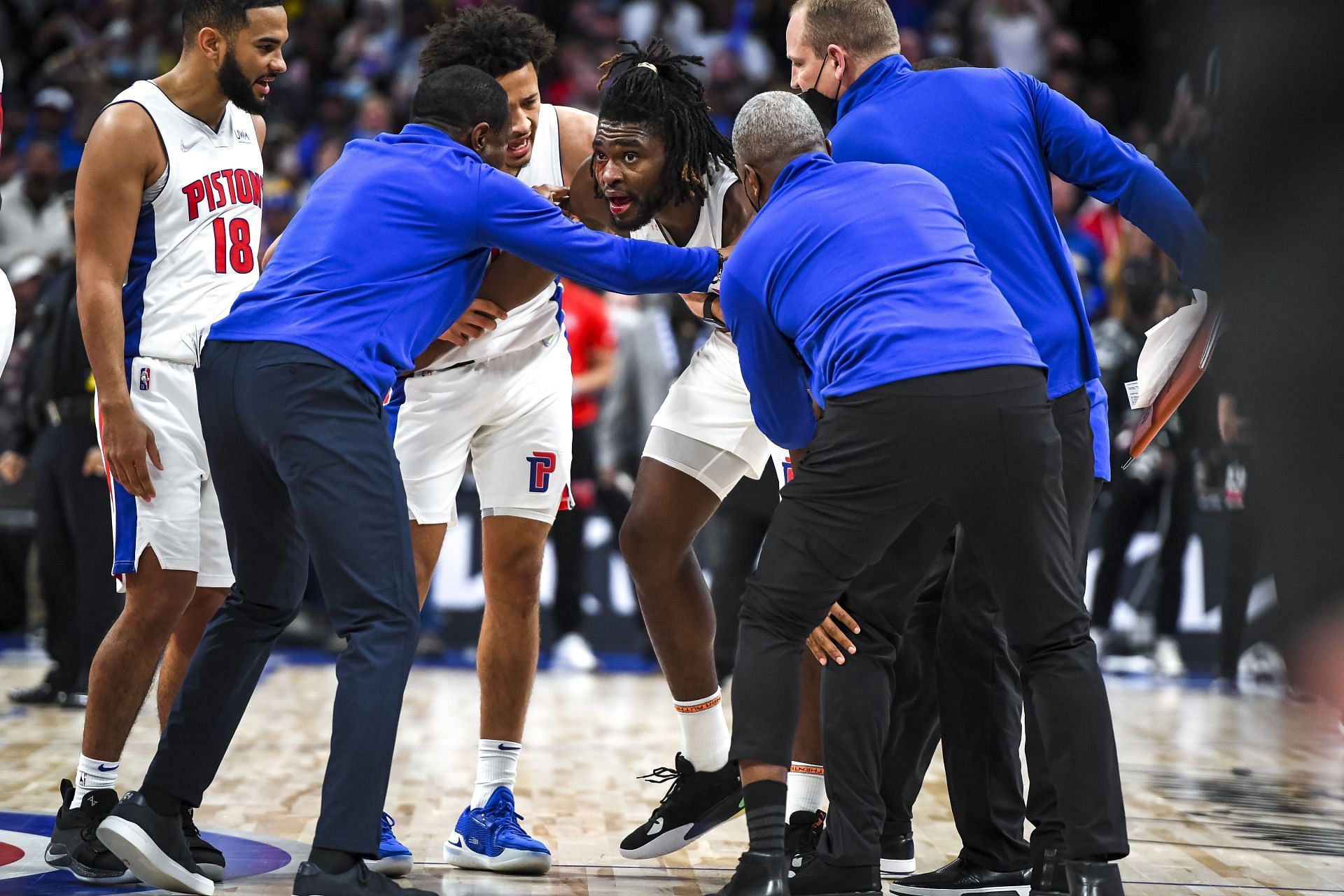 Detroit Pistons center Isaiah Stewart gets medical attention after an altercation with Los Angeles Lakers star LeBron James.