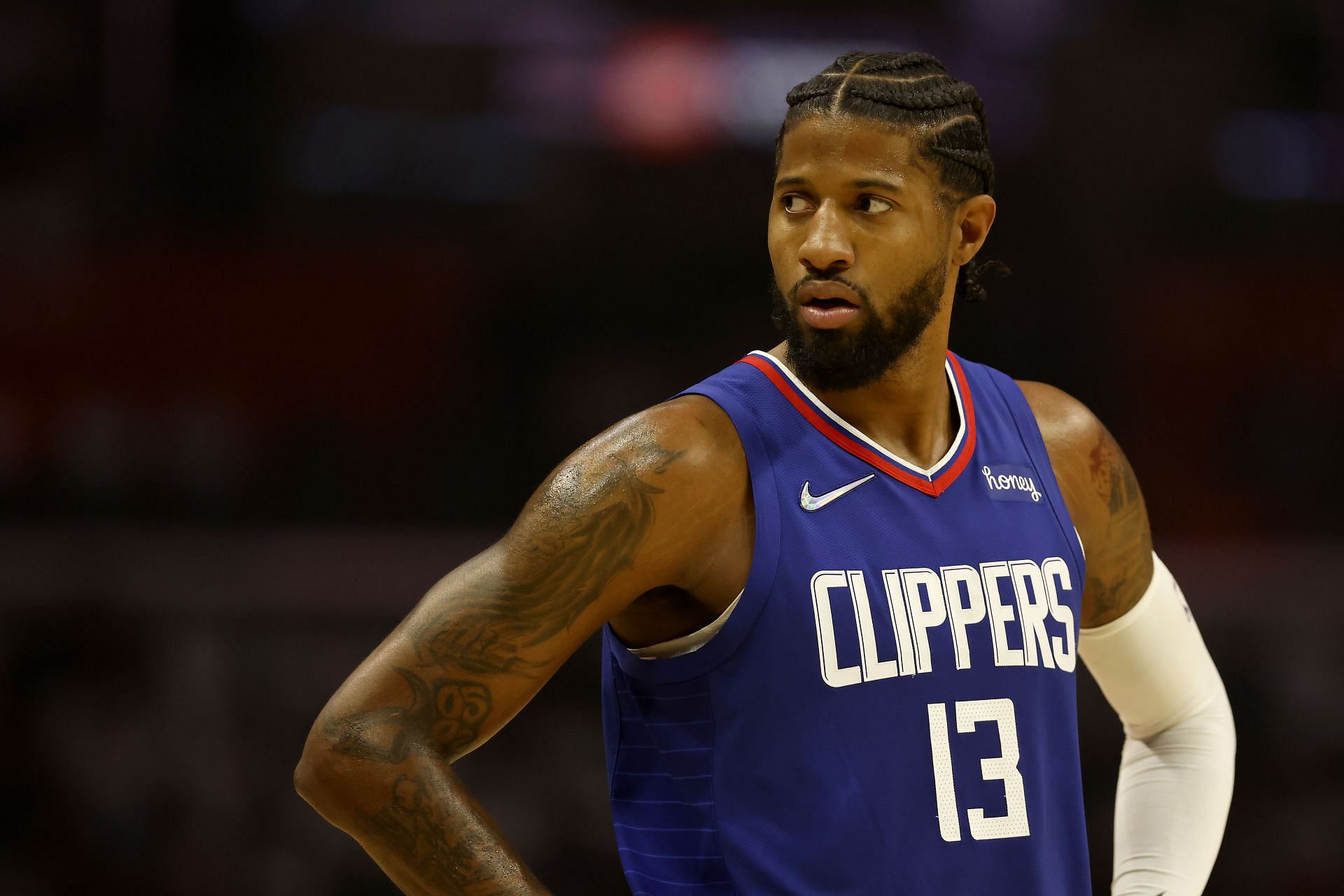 Paul George #13 of the LA Clippers looks on during the first half of a game against the Memphis Grizzlies at Staples Center on October 23, 2021 in Los Angeles, California.