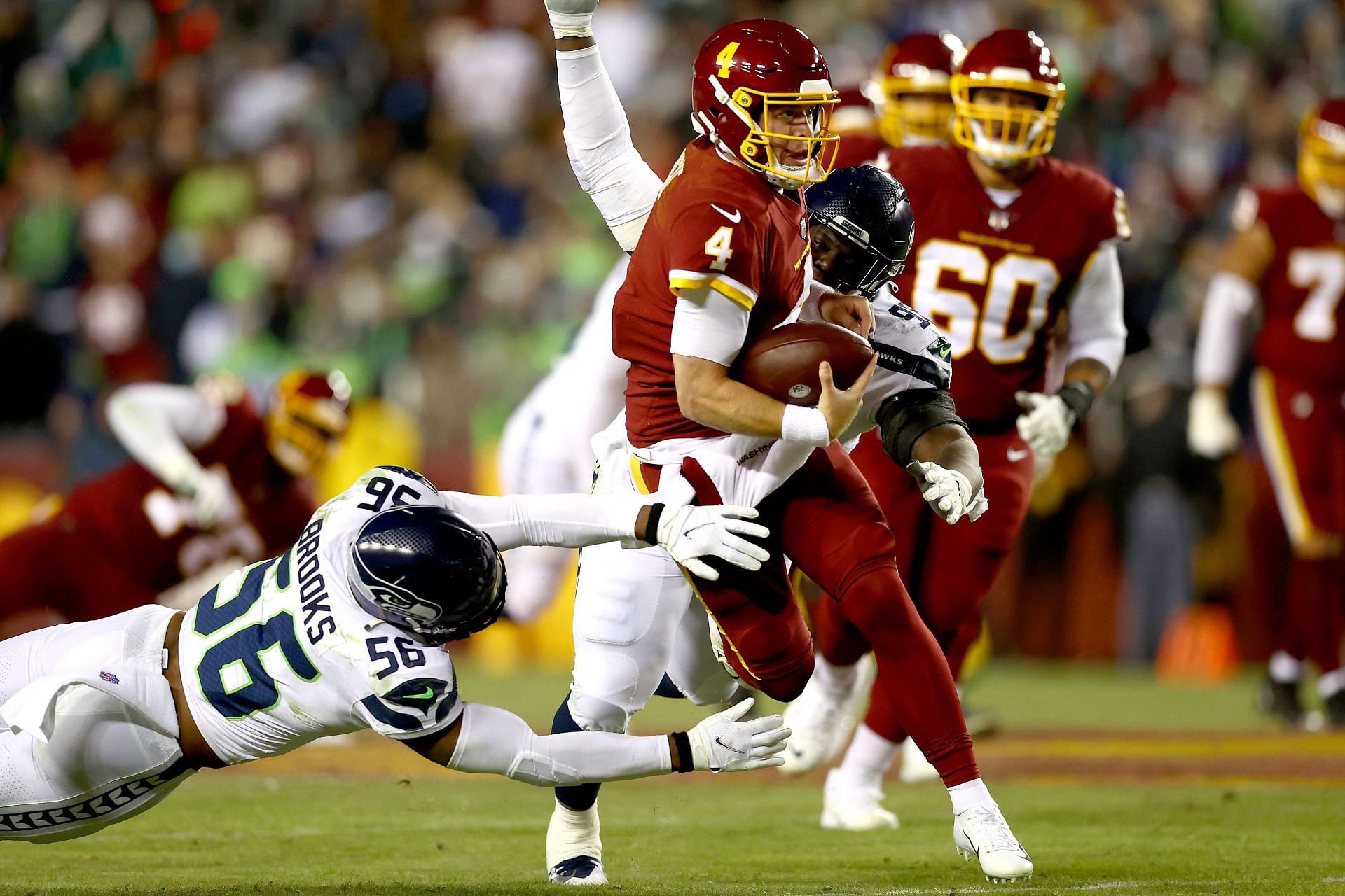Taylor Heinicke (4) escapes from Seattle pressure during Monday night&#039;s prime time showdown (Photo: Getty)