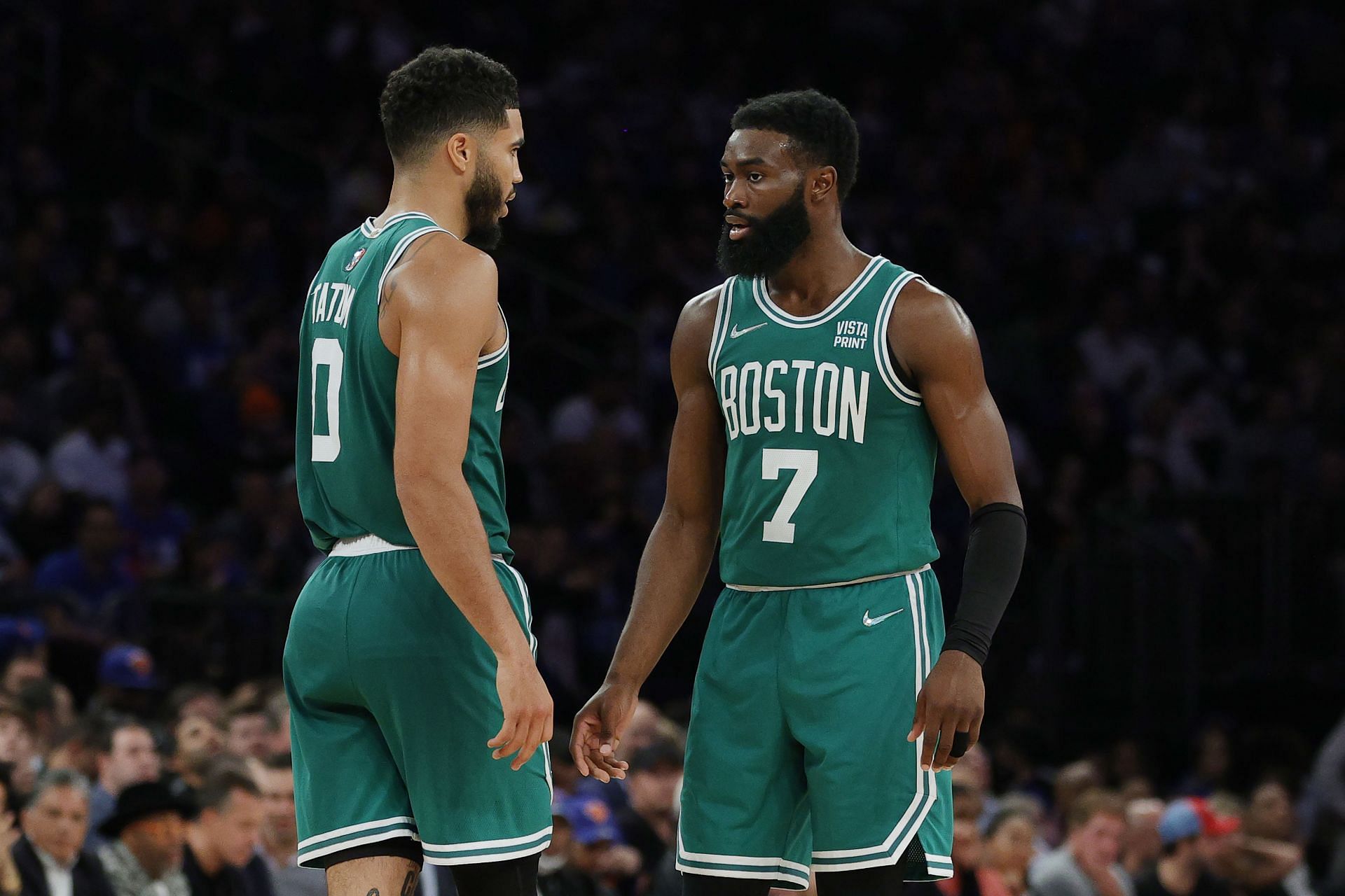 Jaylen Brown #7 talks with Jayson Tatum #0 of the Boston Celtics