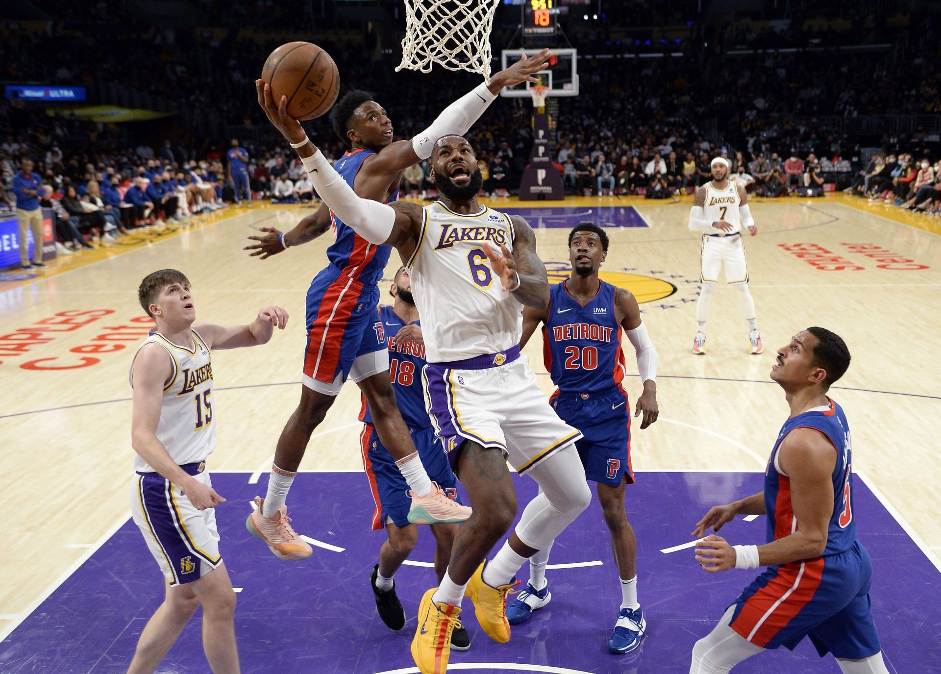 LeBron James #6 of the Los Angeles Lakers drives to the basket ahead of Hamidou Diallo #6 of the Detroit Pistons