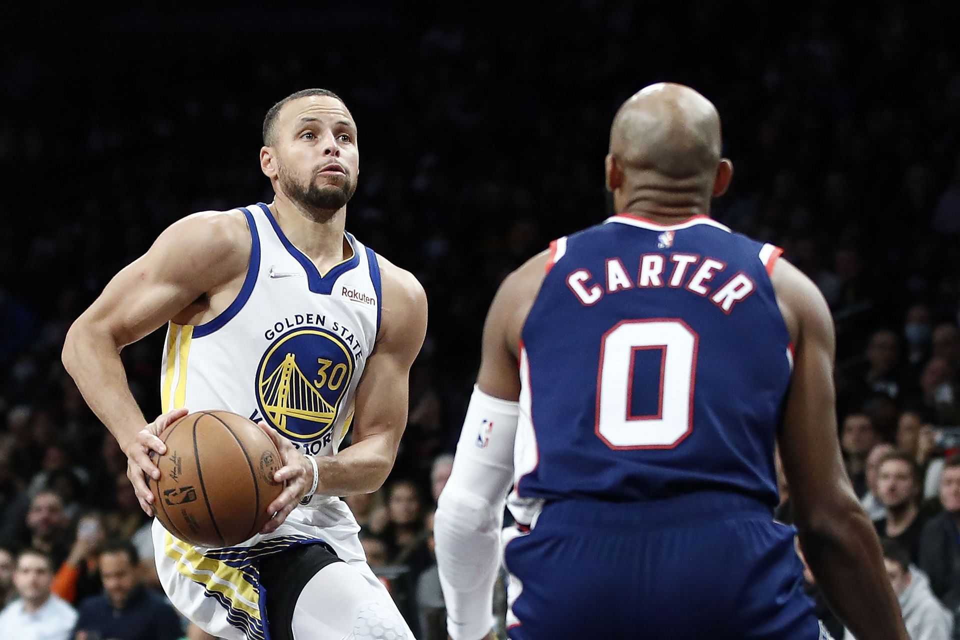 Stephen Curry drives as Jevon Carter of the Brooklyn Nets defends during the second half at Barclays Center on Nov. 16 in the Brooklyn borough of New York City. The Warriors won 117-99.