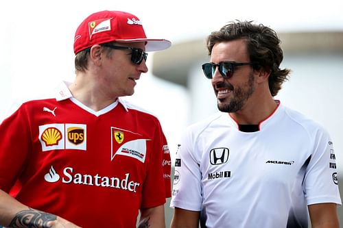 An old picture of Fernando Alonso and Kimi Raikkonen having a tete-a-tete in the paddock.