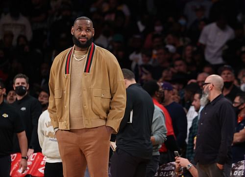 LeBron James #6 of the Los Angeles Lakers walks on court after a timeout during a 126-123 Lakers overtime win over the Charlotte Hornets at Staples Center on November 08, 2021 in Los Angeles, California.