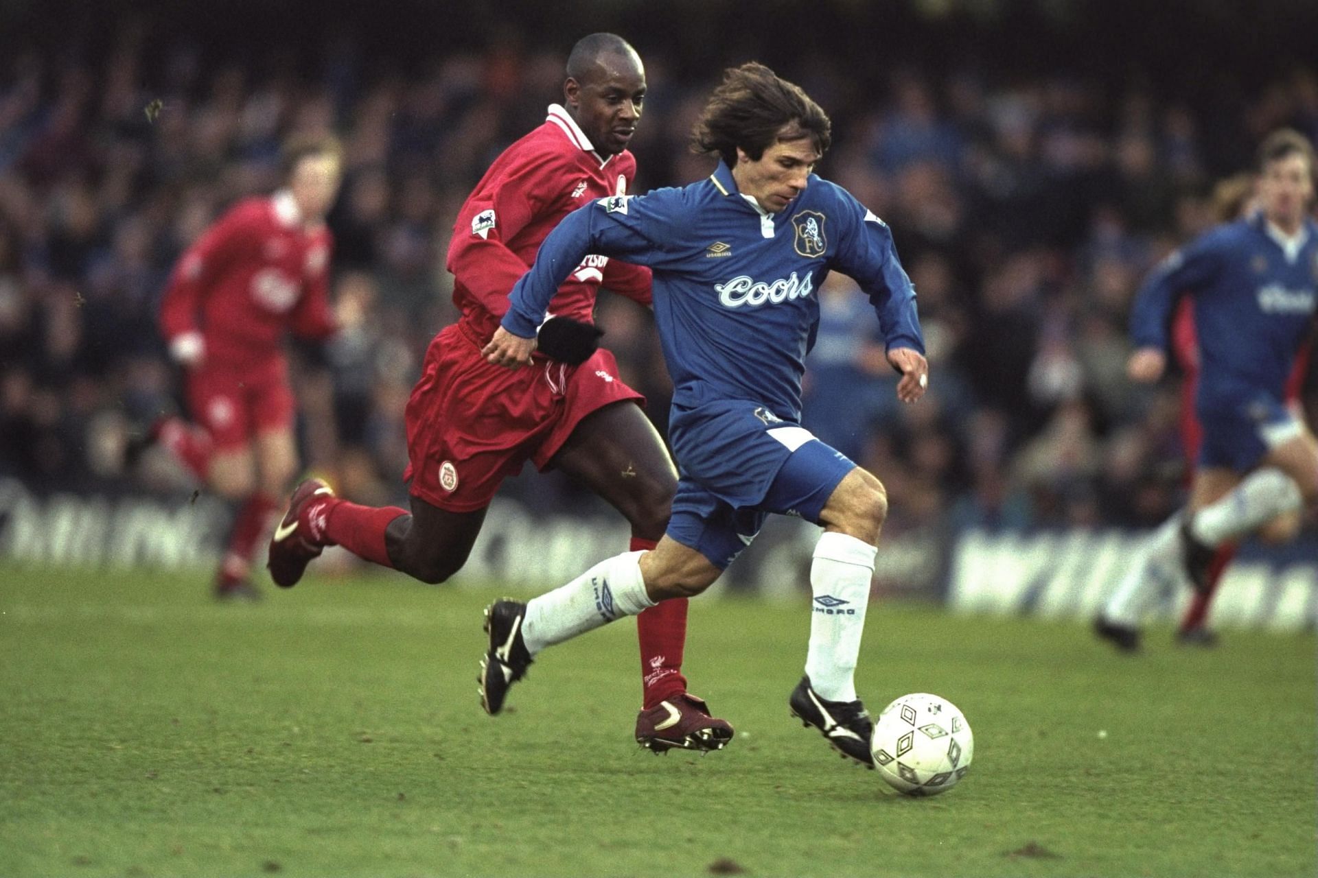 1 Jan 1997: Gianfranco Zola of Italy and Chelsea is tracked by Michael Thomas of Liverpool during t