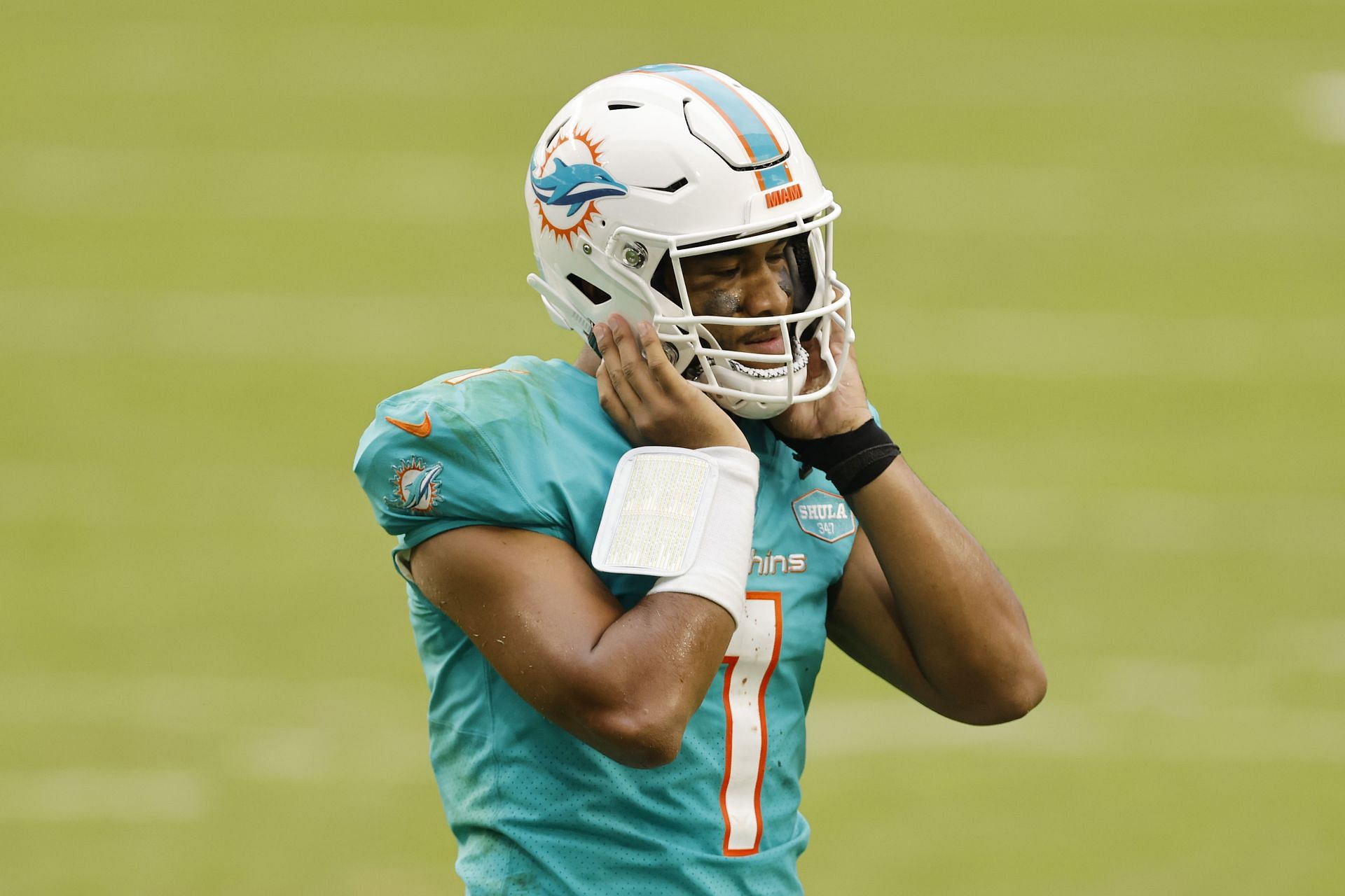 Miami Dolphins Tua putting helmet on as Jacoby Brissett goes down