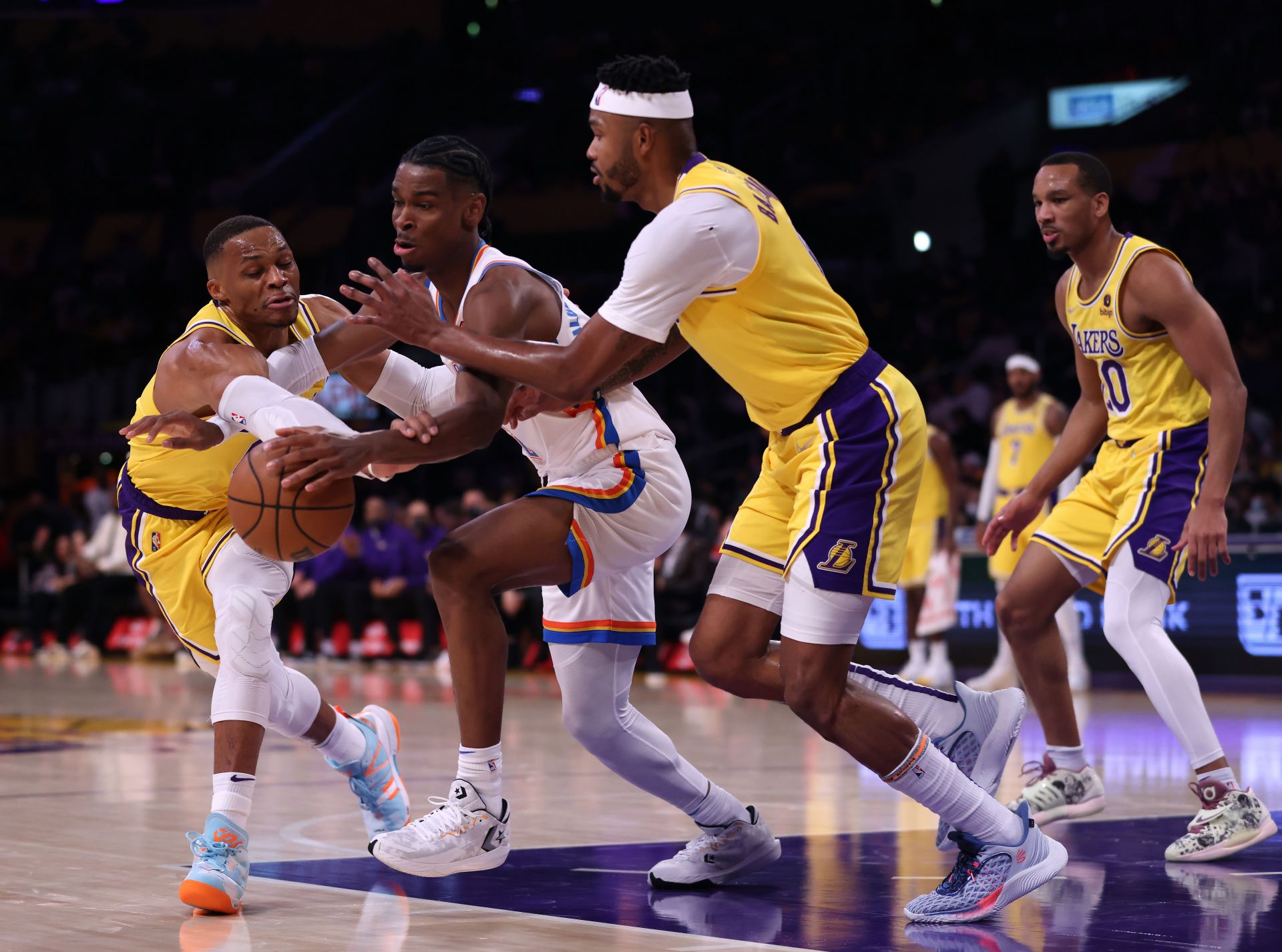 Russell Westbrook battling for the ball with Shai Gilgeous-Alexander