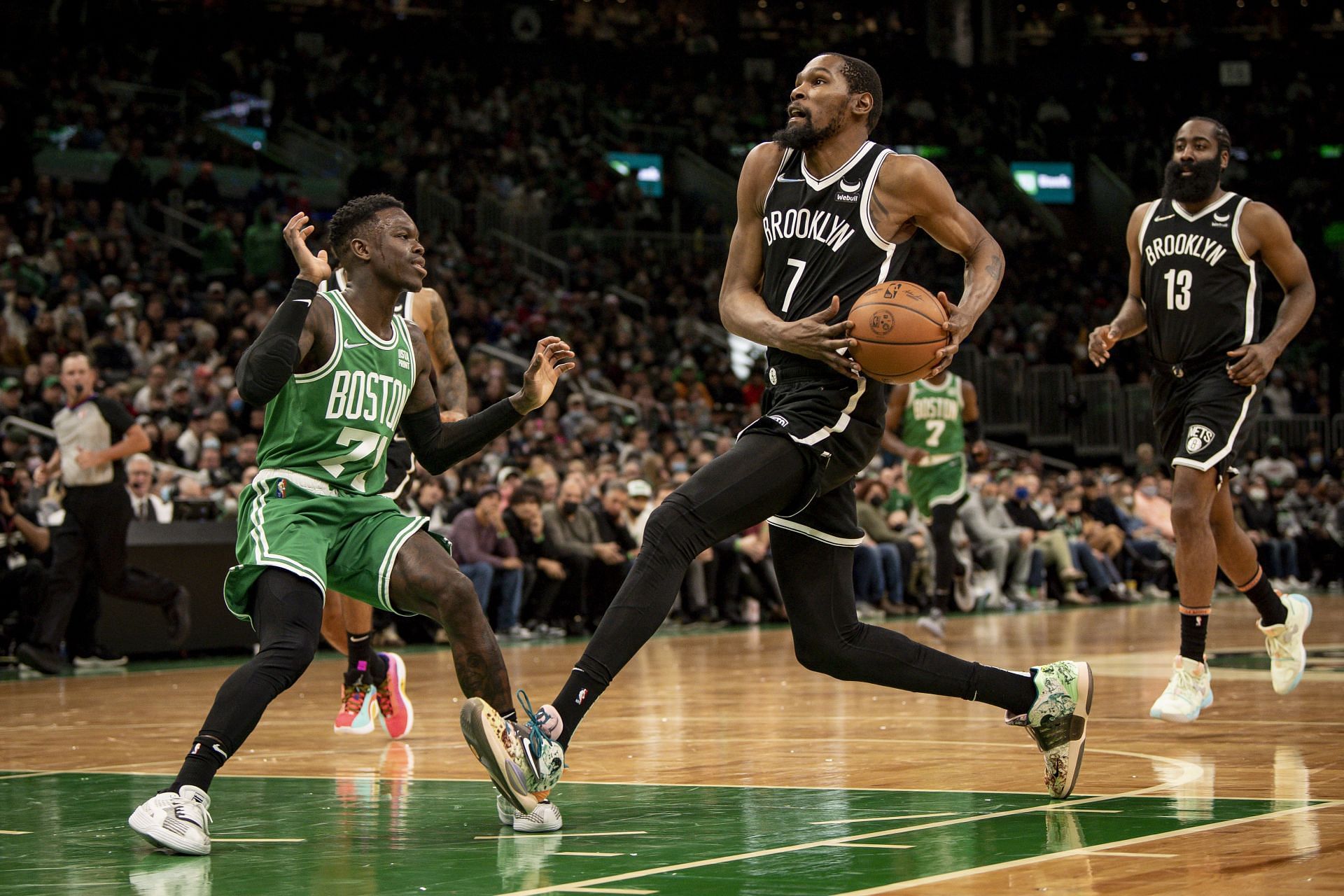 Kevin Durant (#7) of the Brooklyn Nets drives to the basket against the Boston Celtics.