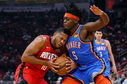 Luguentz Dort of the Oklahoma City Thunder defends Eric Gordon of the Houston Rockets.