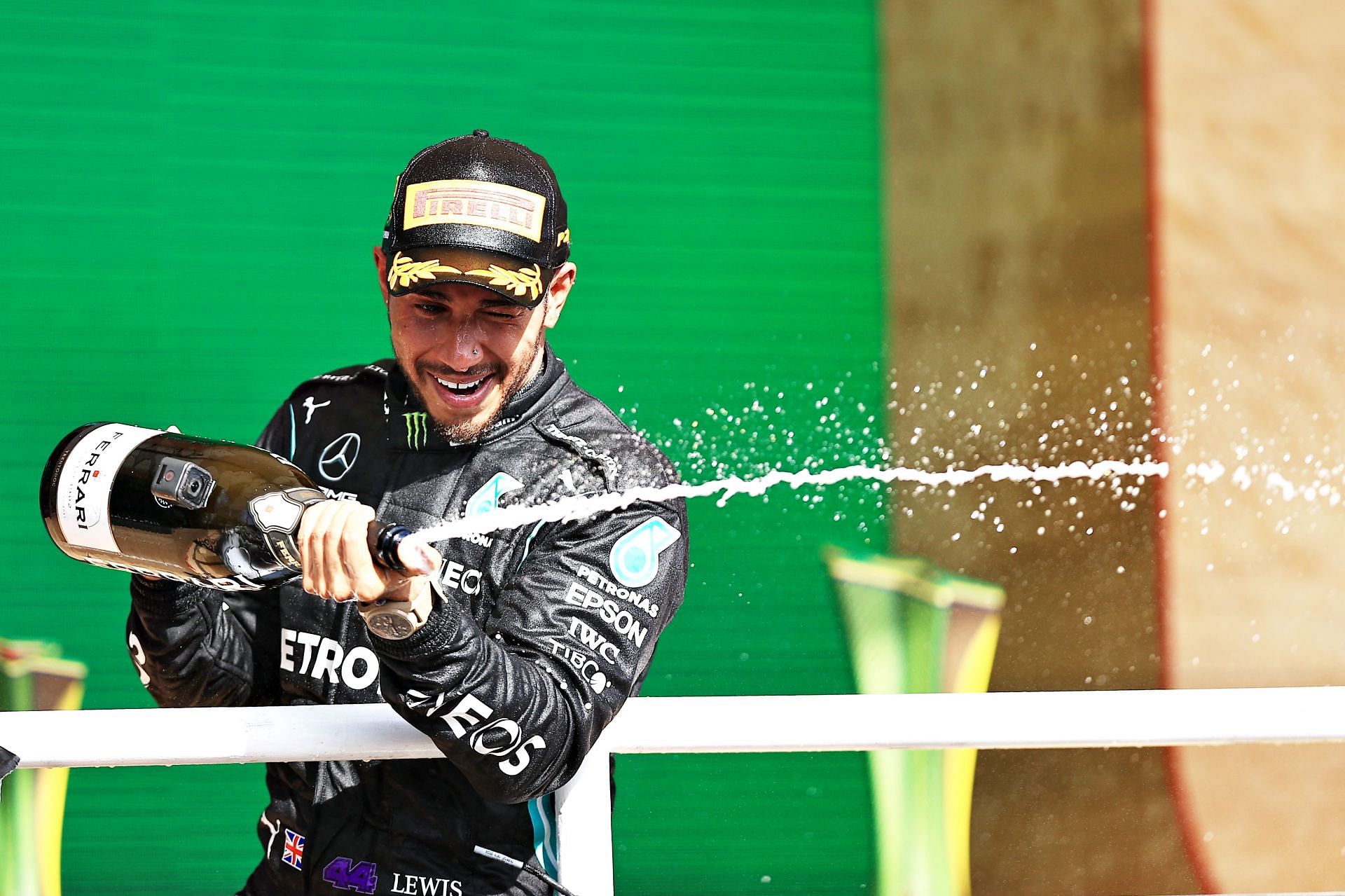 Race winner Lewis Hamilton celebrates on the podium with sparkling wine during the F1 Grand Prix of Brazil. (Photo by Buda Mendes/Getty Images)