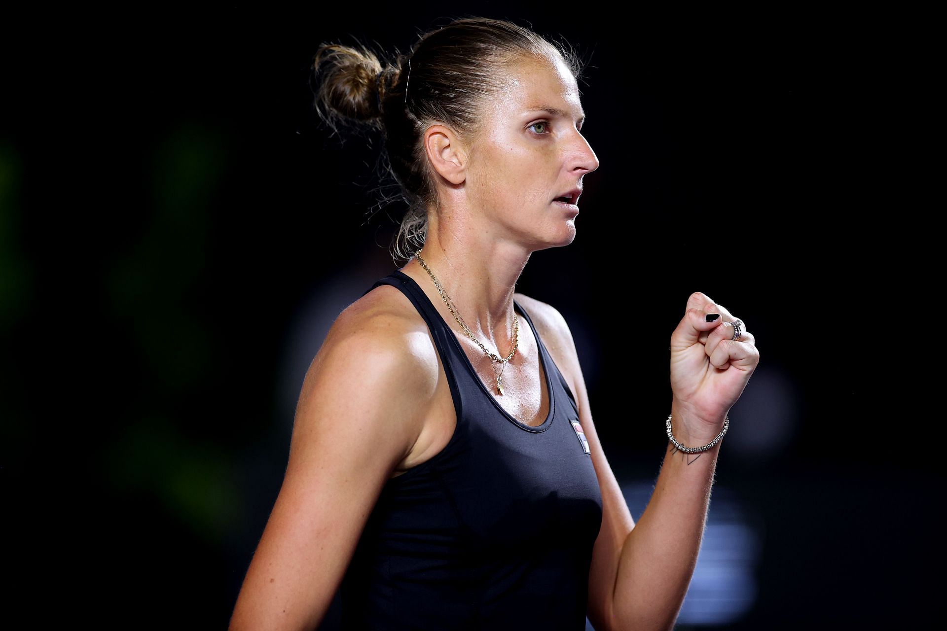 Karolina Pliskova celebrates winning a point against Garbine Muguruza at the 2021 WTA Finals