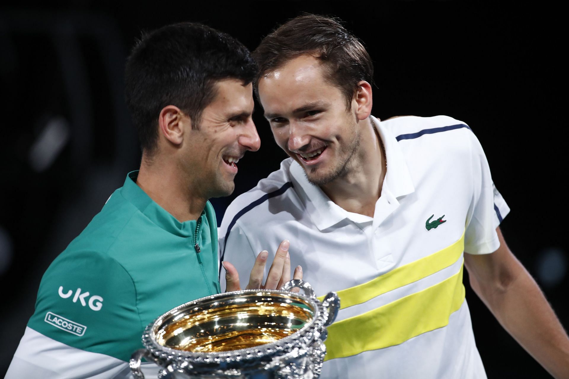 Novak Djokovic and Daniil Medvedev share a laugh after the final of the 2021 Australian Open.
