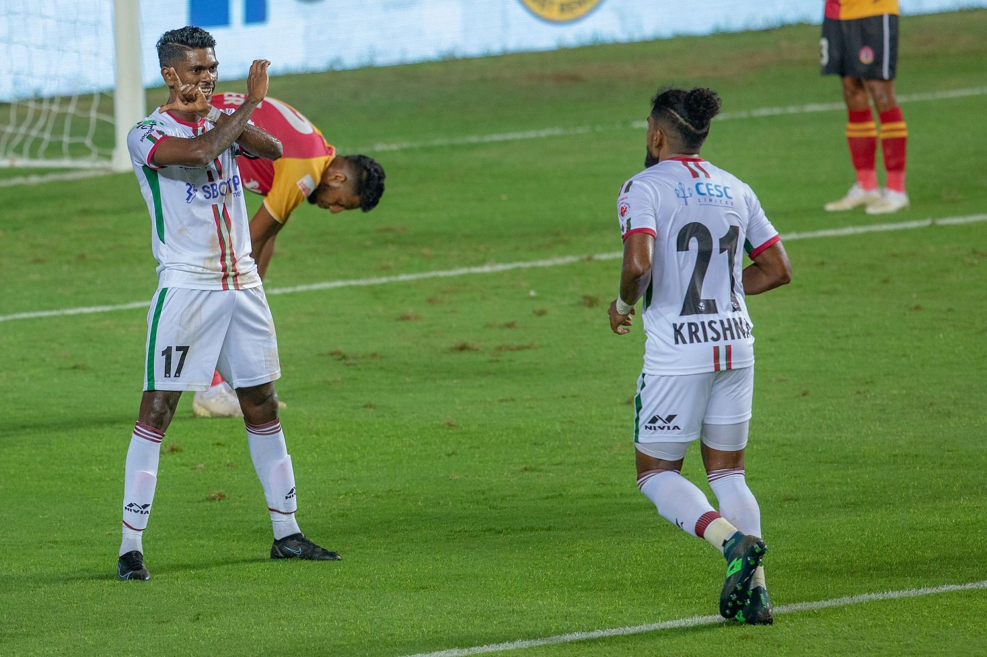 Liston Colaco (left) and Roy Krishna celebrate during ATK Mohun Bagan&#039;s victory over SC East Bengal in the Indian Super League.