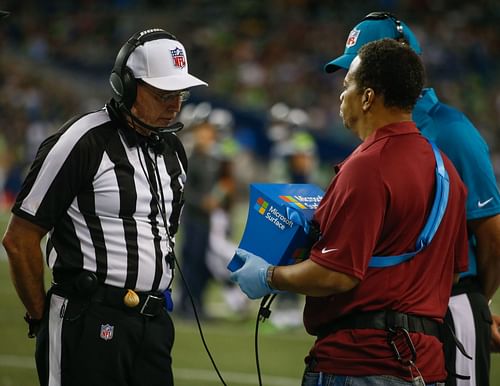 NFL referee Tony Corrente watching a replay