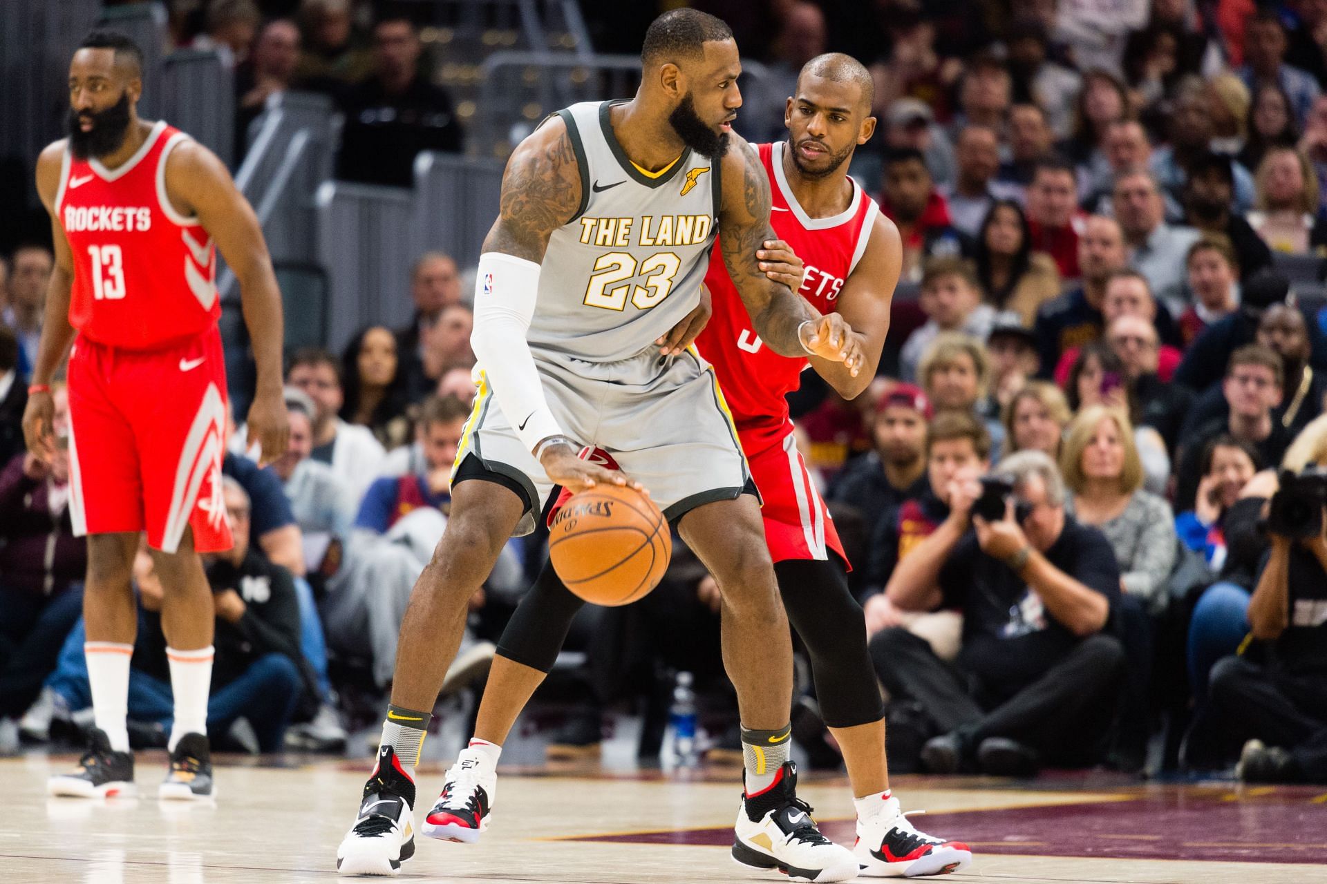 LeBron James #23 of the Cleveland Cavaliers tries to drive around Chris Paul #3