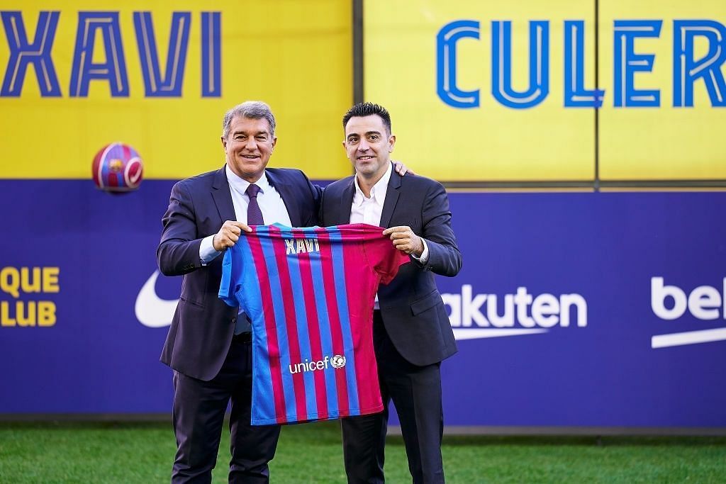 (L) LAPORTA and the newly appointed Barcelona manager XAVI (R)