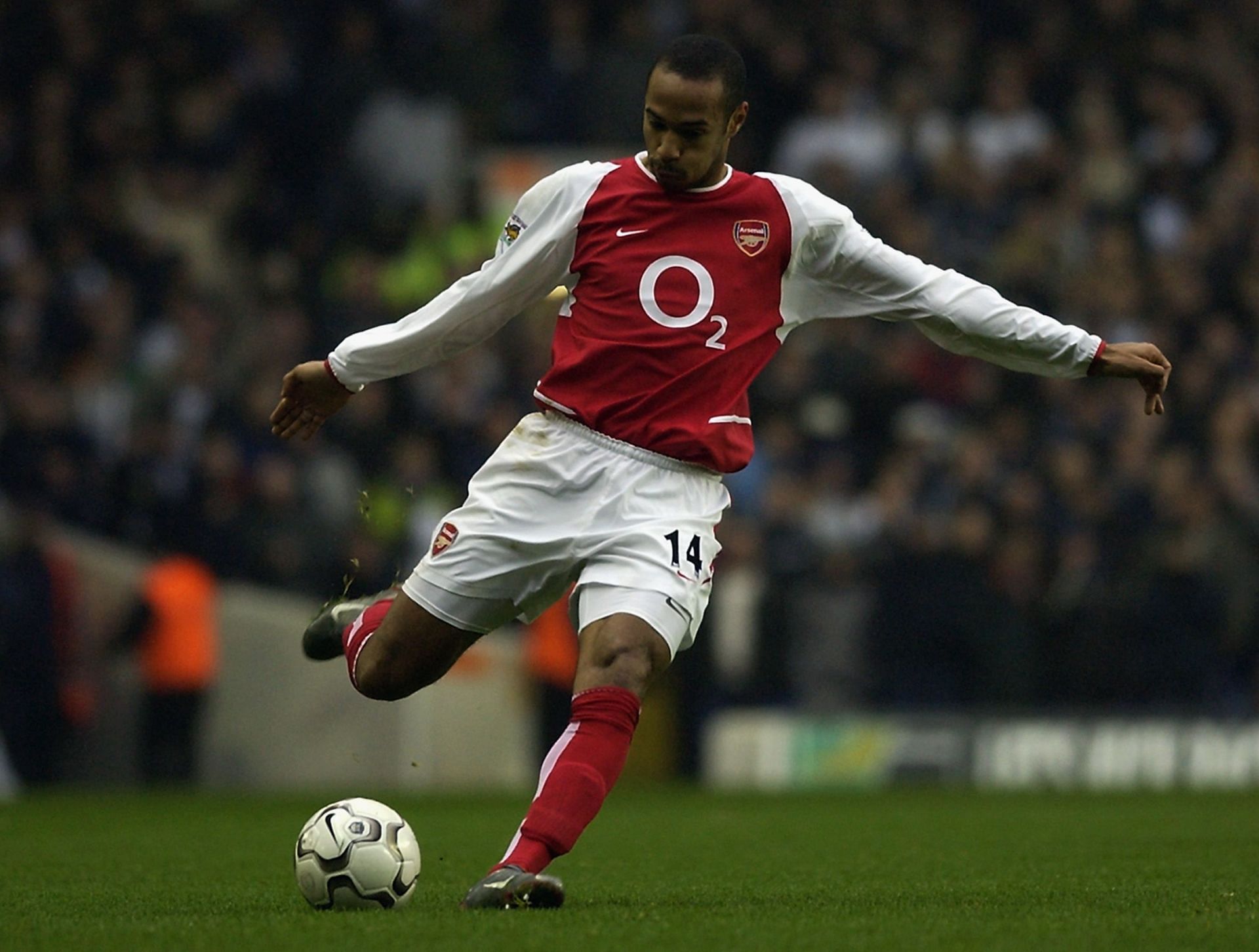 Thierry Henry of Arsenal prepares to strike the ball...