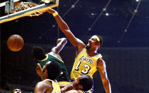 Wilt Chamberlain dunking the ball