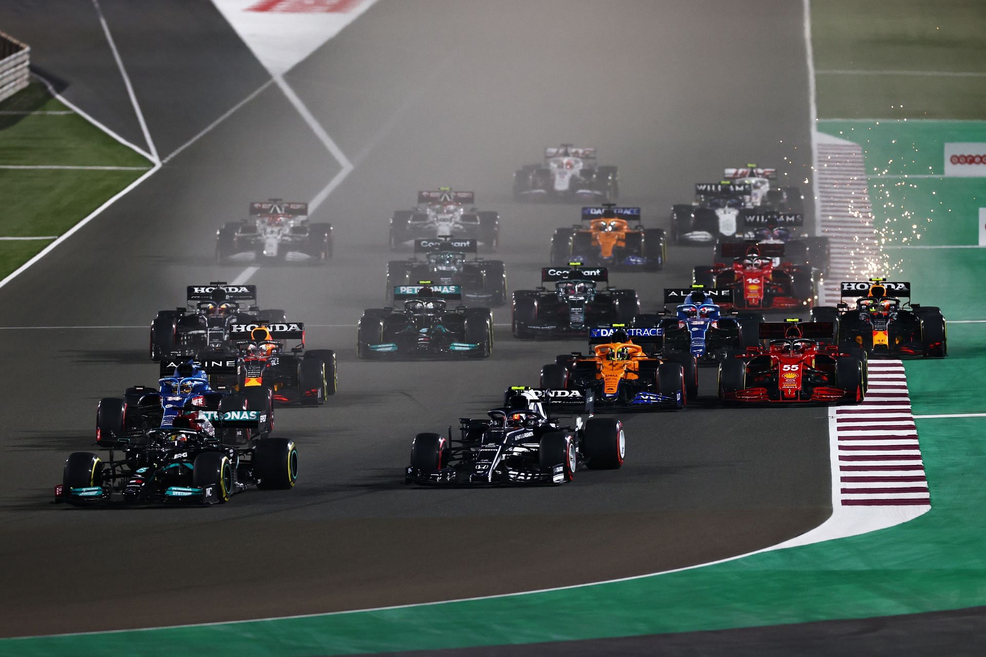 F1 Grand Prix of Qatar - Lewis Hamilton leads the pack into Turn 1.