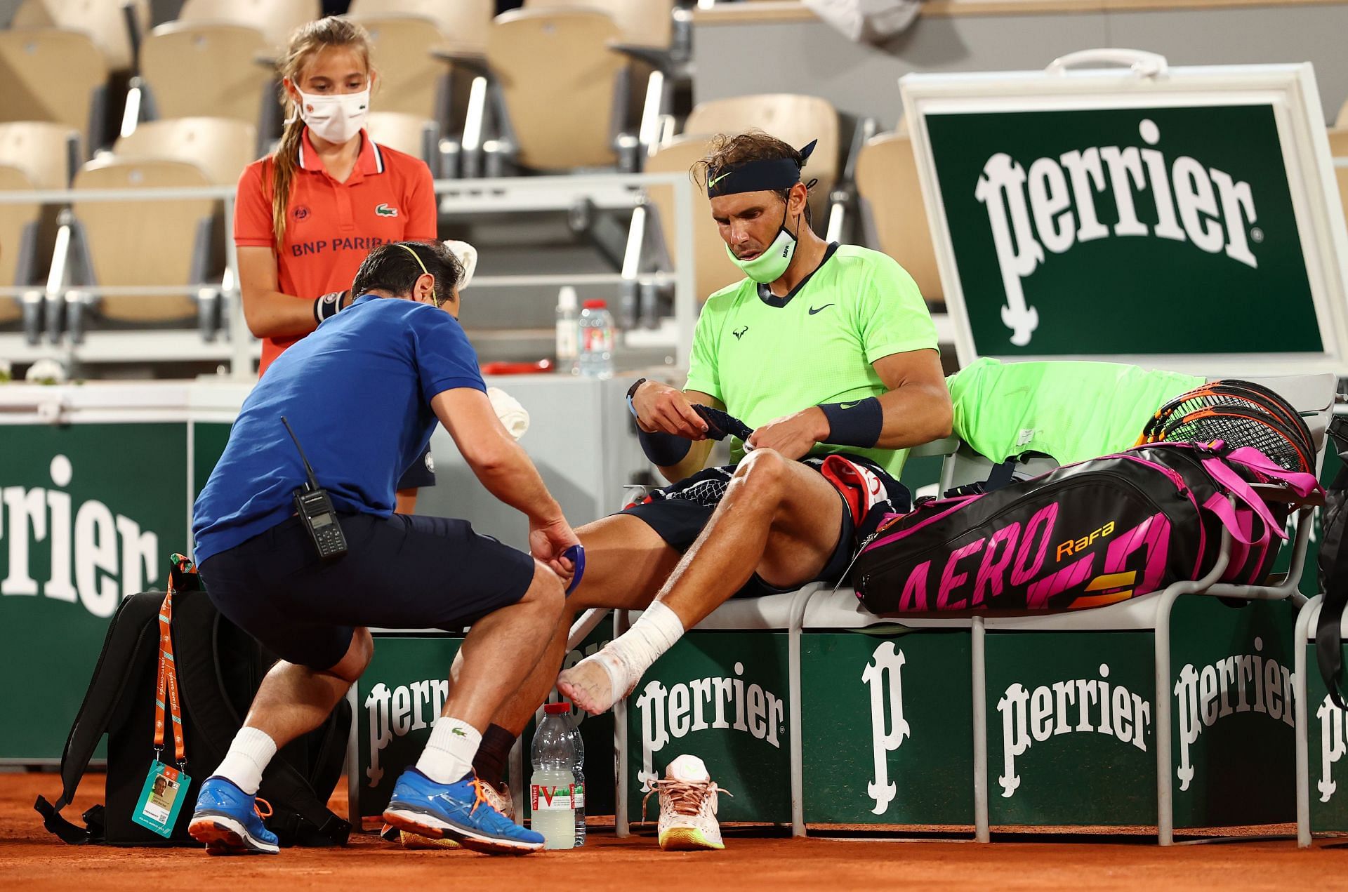 Rafael Nadal getting treatment for his foot at the 2021 French Open