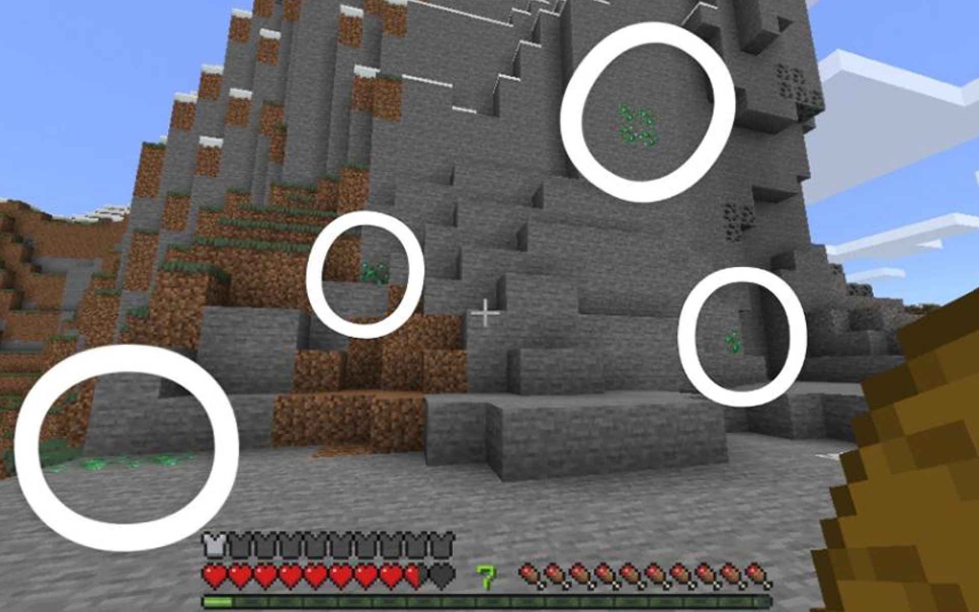 An image of many exposed emerald ores (Image via u/ravennn25 on Reddit)